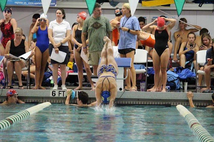 Junior Emma Davis diving in for her swim