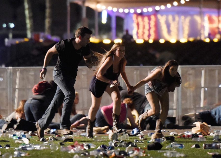 People run after gunfire is heard at the festival.