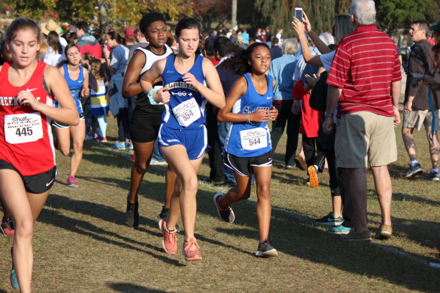 Mia Koppari strides past the competition at cross country state