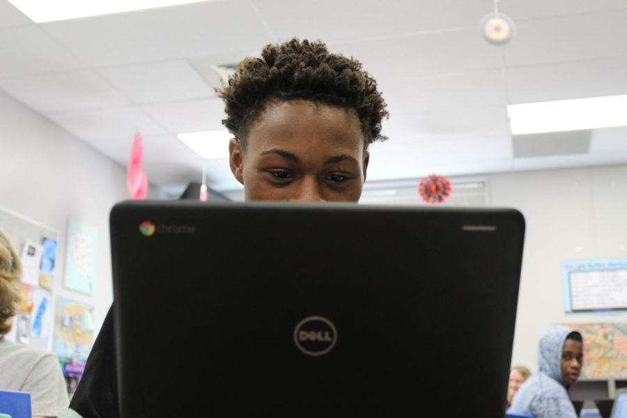 student using his Chromebook.