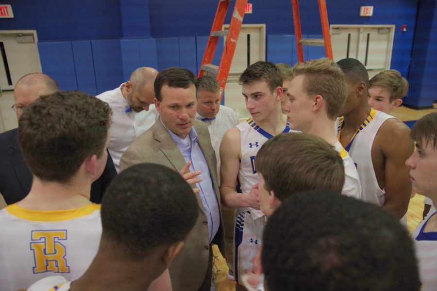 Coach Josh Mills shares a word with his team after their region-clinching defeat of Eastside on February 2. 2018.