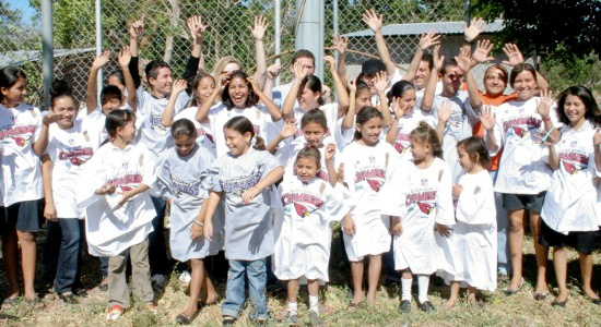 group of children wearing a losing teams merchandise